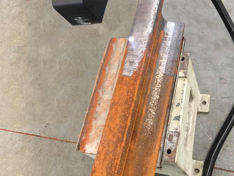 Train track laser rust removal